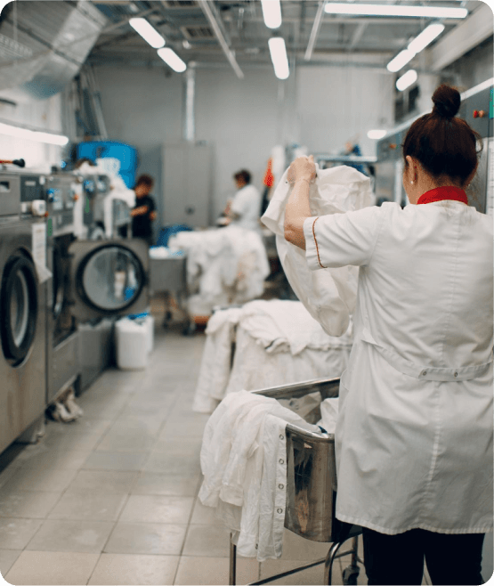 Our laundry facility Laundry team sorting garments at our facility